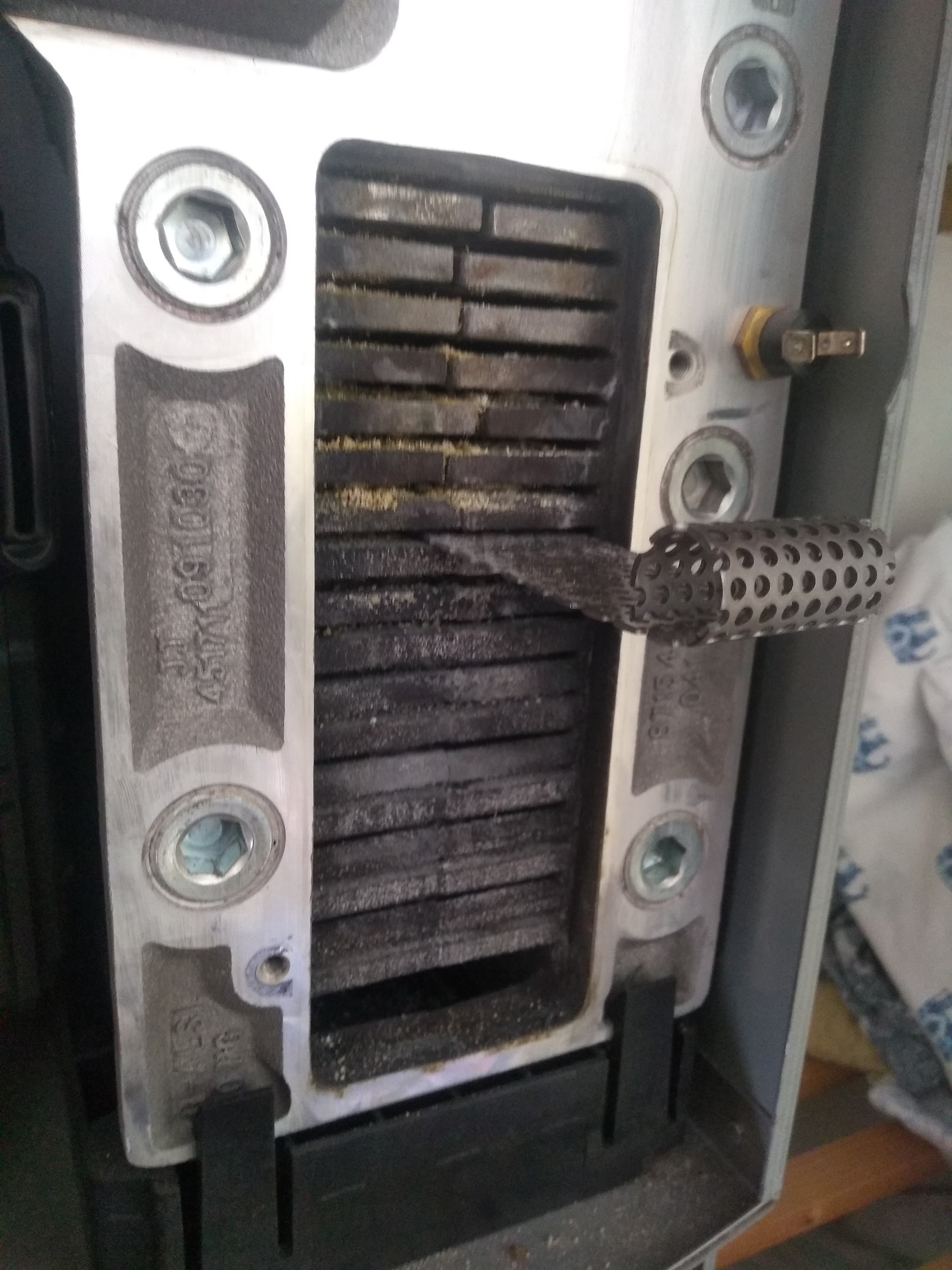 A cast-iron boiler heat exchanger opened up for cleaning