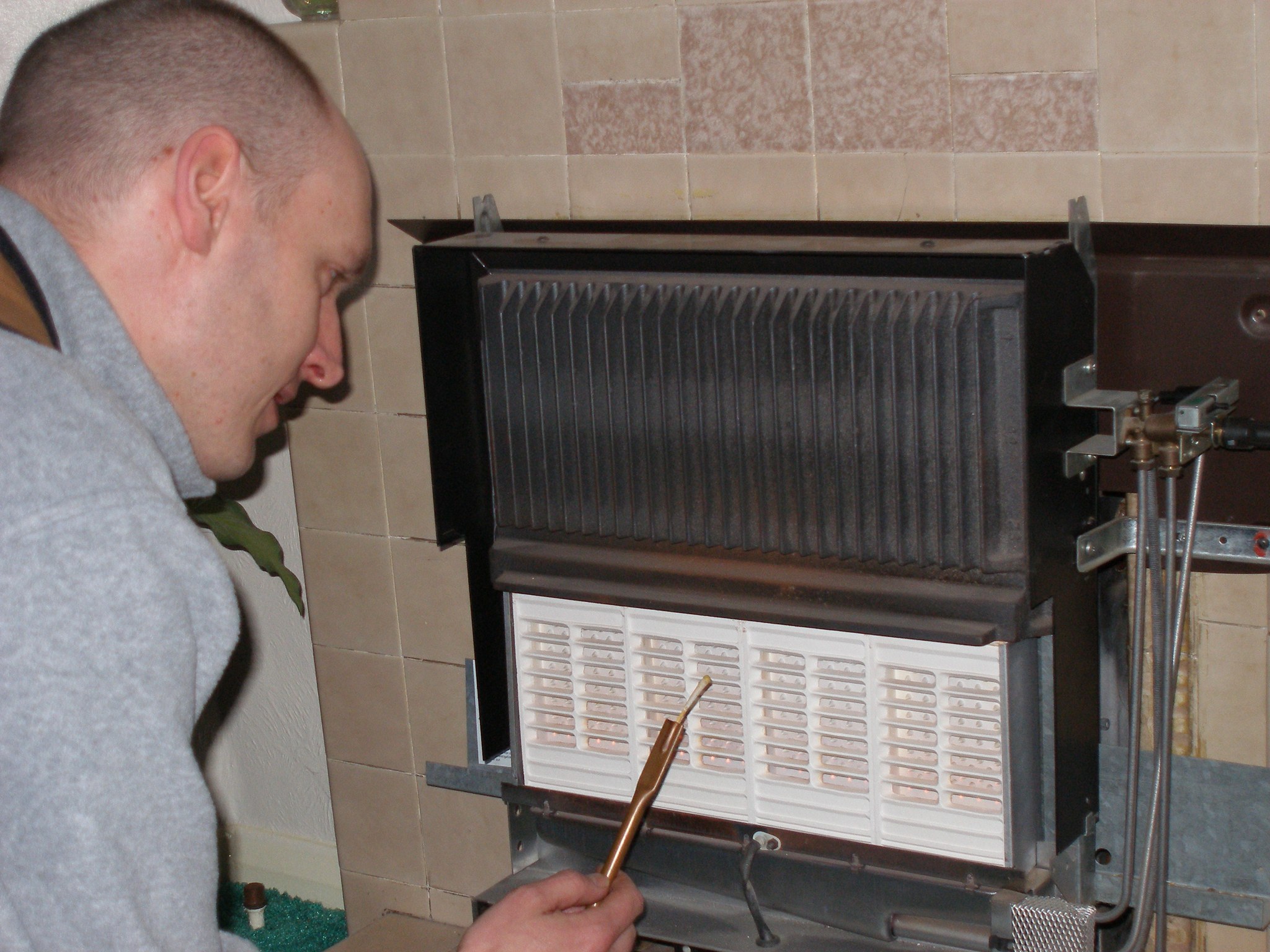 Thomas checking a gas fire